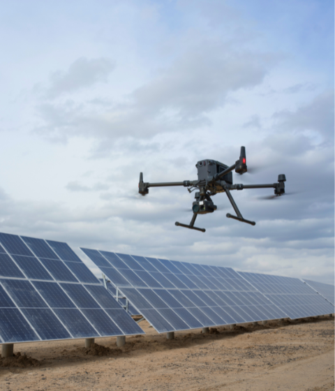 Enterprise drone inspecting solar farm panels for asset monitoring and energy infrastructure management in New Zealand
