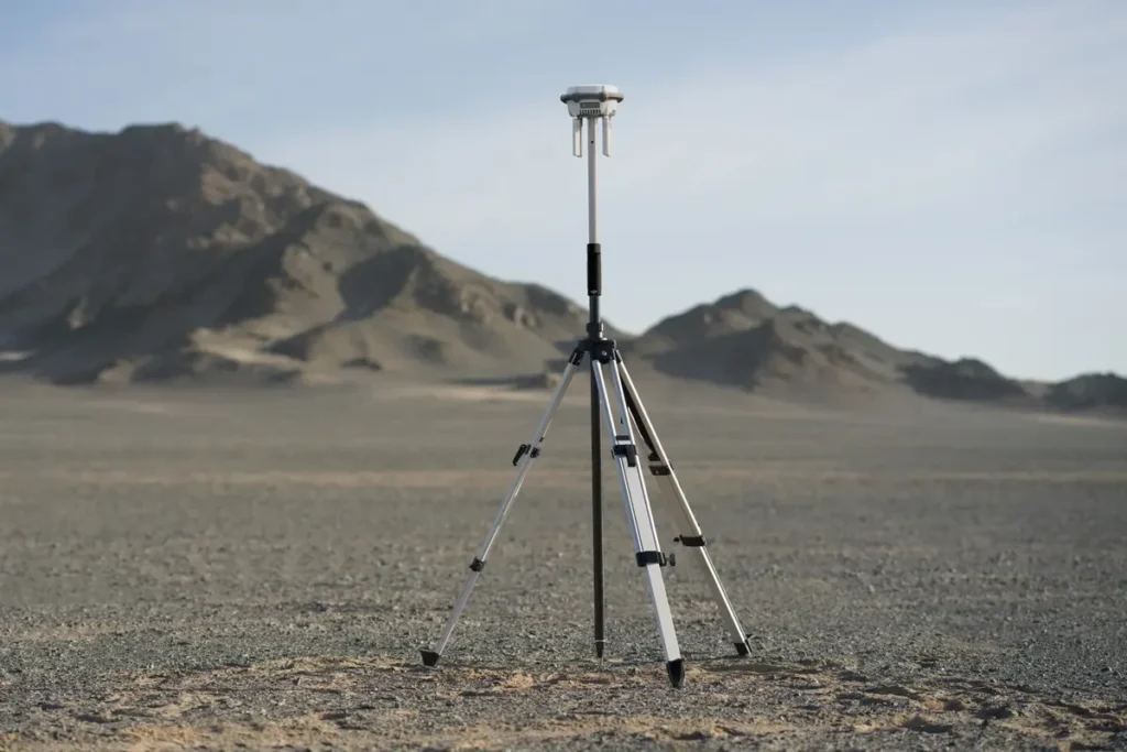 D-RTK 3 Multifunctional Station mounted on the Survey Pole and Tripod Kit in the field