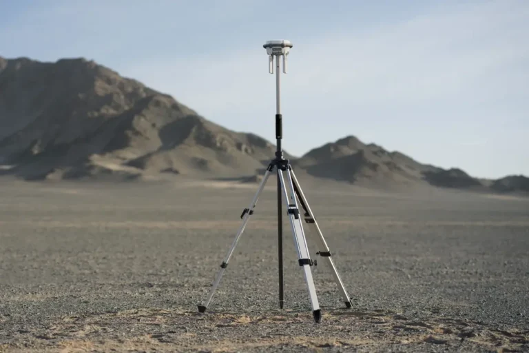 D-RTK 3 Multifunctional Station mounted on the Survey Pole and Tripod Kit in the field